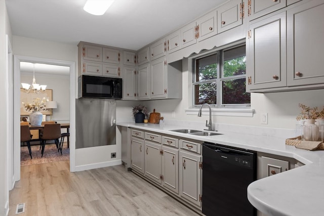 1511 Bunker Hill Dr, Chattanooga, TN 37421 - kitchen with black appliances, a sink, light countertops, and gray cabinets