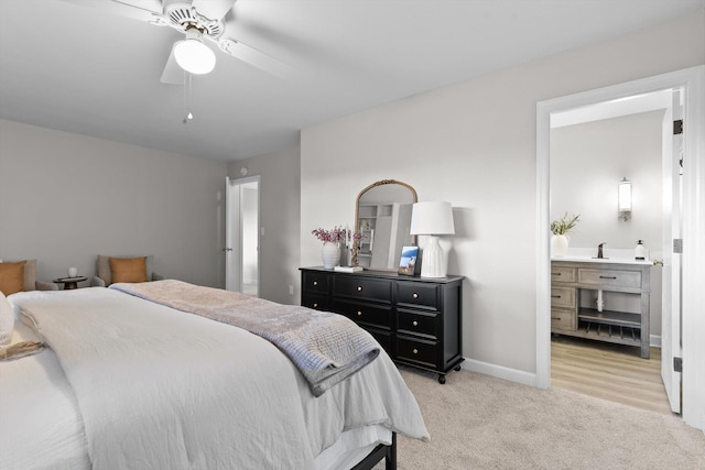 1511 Bunker Hill Dr, Chattanooga, TN 37421 - bedroom featuring a sink, light carpet, baseboards, ensuite bathroom, and ceiling fan