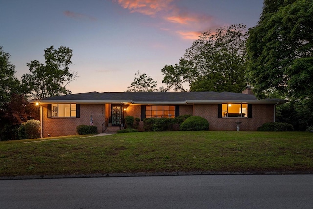 1511 Bunker Hill Dr, Chattanooga, TN 37421 - ranch-style home with brick siding, a lawn, and a chimney