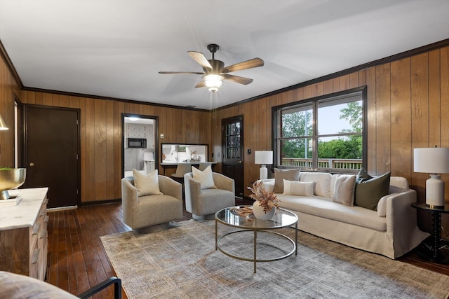 1511 Bunker Hill Dr, Chattanooga, TN 37421 - living area featuring crown molding, wood walls, a ceiling fan, and dark wood-style flooring