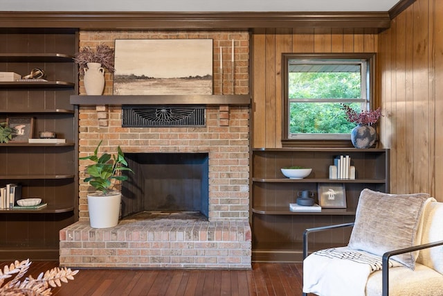 1511 Bunker Hill Dr, Chattanooga, TN 37421 - living area featuring wood-type flooring, a brick fireplace, ornamental molding, and wooden walls