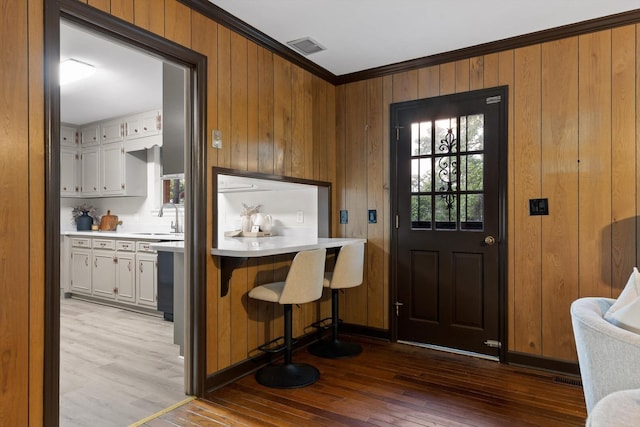 1511 Bunker Hill Dr, Chattanooga, TN 37421 - entrance foyer with ornamental molding, wood walls, and wood-type flooring