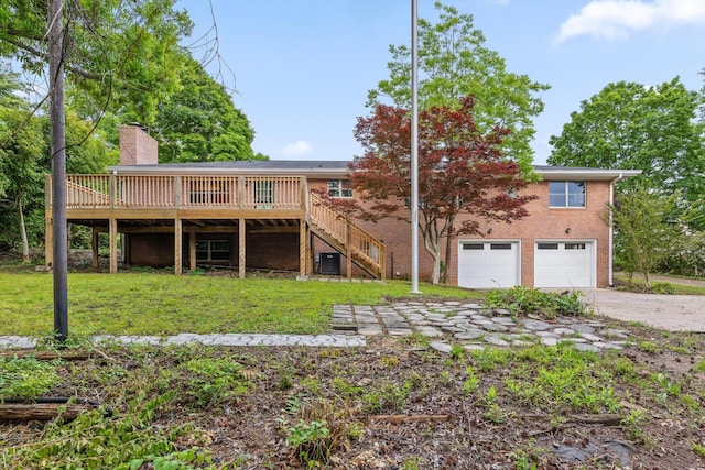 1511 Bunker Hill Dr, Chattanooga, TN 37421 - rear view of property featuring an attached garage, driveway, a deck, a chimney, and stairway