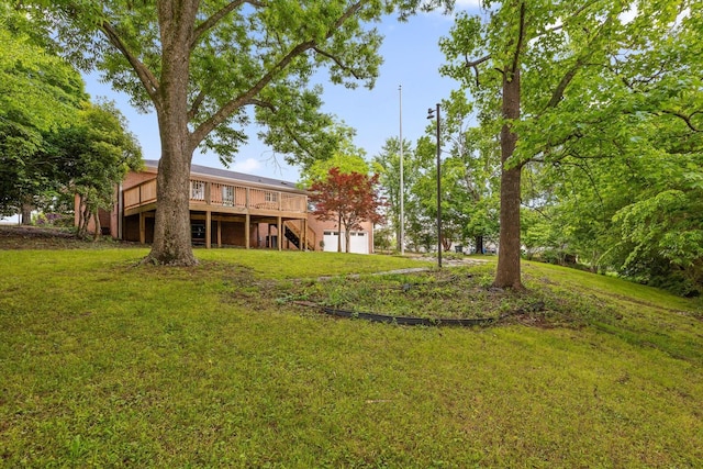 1511 Bunker Hill Dr, Chattanooga, TN 37421 - view of grassy yard featuring stairs, a deck, and a garage
