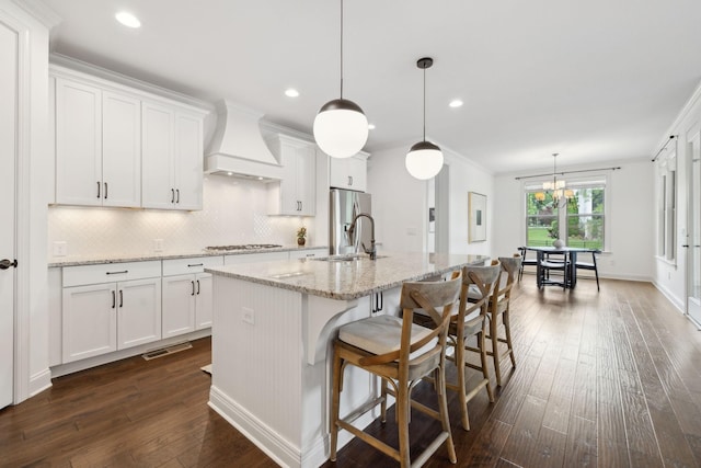 1022 Echelon Dr, Franklin, TN 37064 - kitchen featuring custom exhaust hood, a sink, dark wood-type flooring, decorative backsplash, and gas stovetop