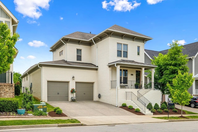 1022 Echelon Dr, Franklin, TN 37064 - italianate home featuring a garage, concrete driveway, brick siding, and roof with shingles
