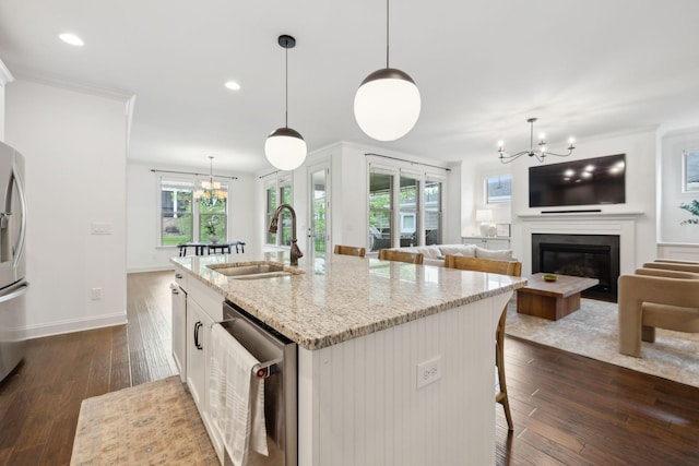 1022 Echelon Dr, Franklin, TN 37064 - kitchen with a chandelier, a sink, appliances with stainless steel finishes, dark wood finished floors, and plenty of natural light