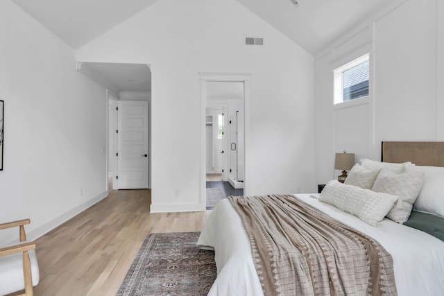 517B River Rouge Dr, Nashville, TN 37209 - bedroom featuring vaulted ceiling, light wood-style floors, and baseboards