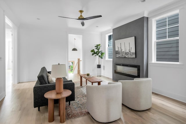 517B River Rouge Dr, Nashville, TN 37209 - living room with wood finished floors, a ceiling fan, a glass covered fireplace, and baseboards