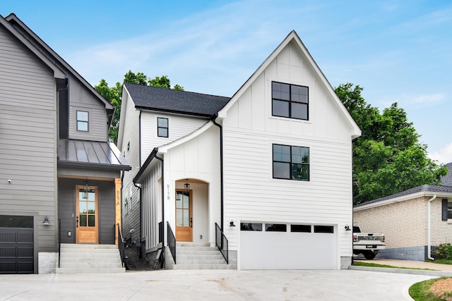 517B River Rouge Dr, Nashville, TN 37209 - view of front of home featuring board and batten siding, driveway, and a garage