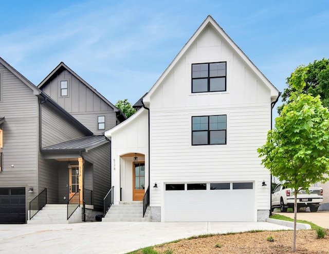 517B River Rouge Dr, Nashville, TN 37209 - modern farmhouse with board and batten siding, an attached garage, driveway, and a standing seam roof