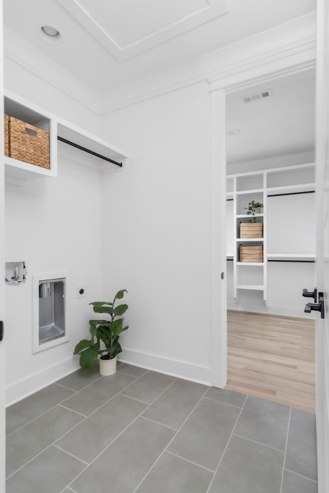 517B River Rouge Dr, Nashville, TN 37209 - laundry room featuring electric dryer hookup, tile patterned floors, and baseboards