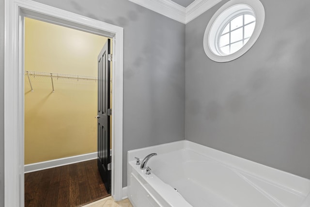 3100 W End Cir Unit 102, Nashville, TN 37203 - full bathroom featuring ornamental molding, a bath, a spacious closet, wood finished floors, and baseboards