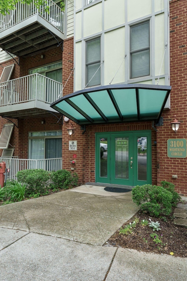 3100 W End Cir Unit 102, Nashville, TN 37203 - doorway to property featuring brick siding and french doors