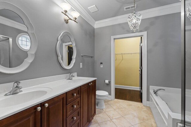 3100 W End Cir Unit 102, Nashville, TN 37203 - bathroom featuring crown molding, double vanity, a bath, toilet, and tile patterned floors