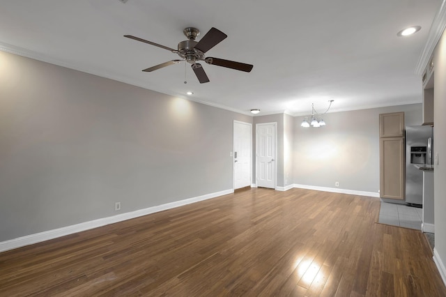 unfurnished living room with a chandelier, dark wood-type flooring, ceiling fan, baseboards, and crown molding
