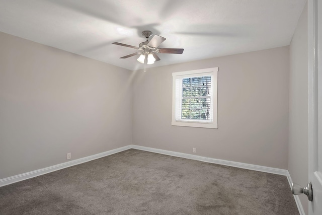 spare room with carpet flooring, ceiling fan, and baseboards