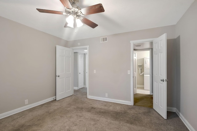 unfurnished bedroom with carpet floors, baseboards, and a ceiling fan