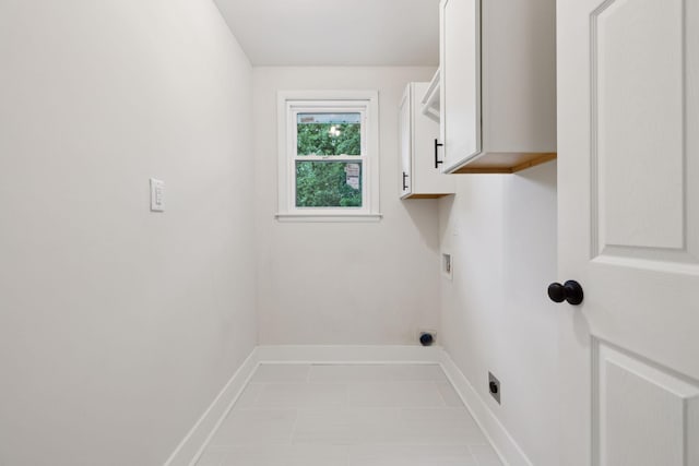 909 Plateau Pkwy, Nashville, TN 37205 - laundry room with cabinet space, baseboards, hookup for an electric dryer, washer hookup, and tile patterned floors