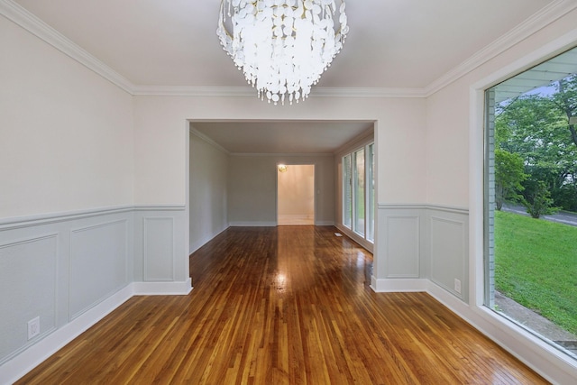 909 Plateau Pkwy, Nashville, TN 37205 - unfurnished dining area with a chandelier, plenty of natural light, ornamental molding, wood-type flooring, and a wainscoted wall