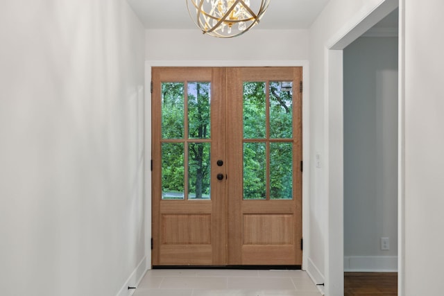 909 Plateau Pkwy, Nashville, TN 37205 - doorway to outside featuring a chandelier, baseboards, and french doors