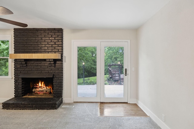 909 Plateau Pkwy, Nashville, TN 37205 - unfurnished living room featuring a brick fireplace, ceiling fan, carpet, and baseboards