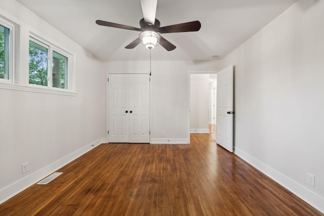 909 Plateau Pkwy, Nashville, TN 37205 - unfurnished bedroom with dark wood-type flooring, baseboards, a closet, and a ceiling fan
