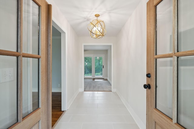 909 Plateau Pkwy, Nashville, TN 37205 - hall with a chandelier, light tile patterned floors, and baseboards