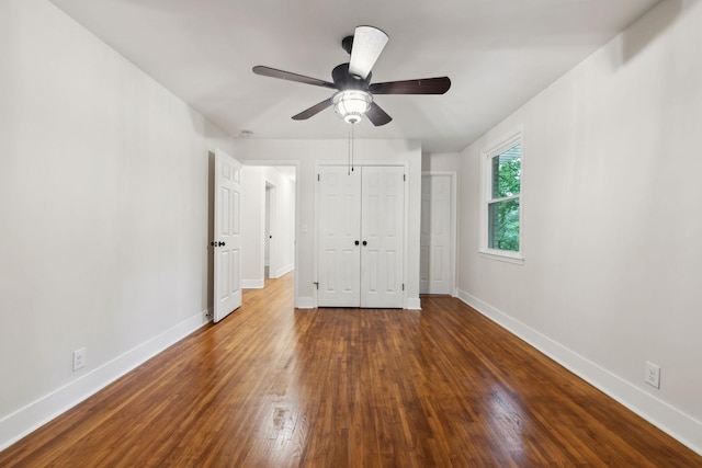 909 Plateau Pkwy, Nashville, TN 37205 - unfurnished bedroom featuring baseboards, dark wood finished floors, a closet, and a ceiling fan