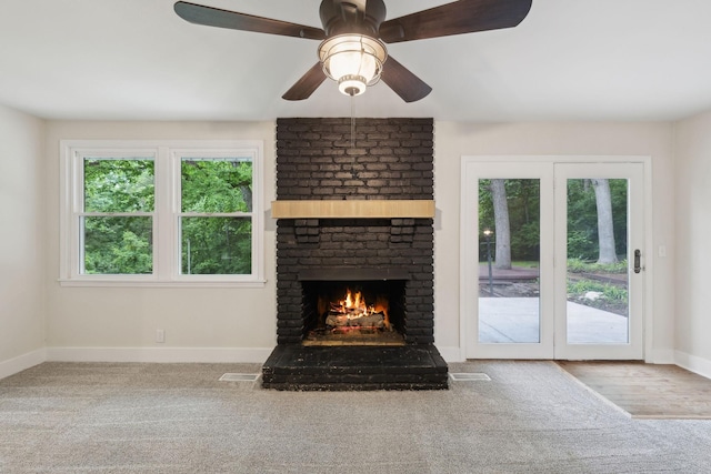 909 Plateau Pkwy, Nashville, TN 37205 - unfurnished living room featuring baseboards, carpet flooring, a brick fireplace, and ceiling fan