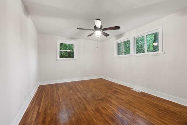 909 Plateau Pkwy, Nashville, TN 37205 - empty room featuring healthy amount of natural light, ceiling fan, dark wood finished floors, and baseboards
