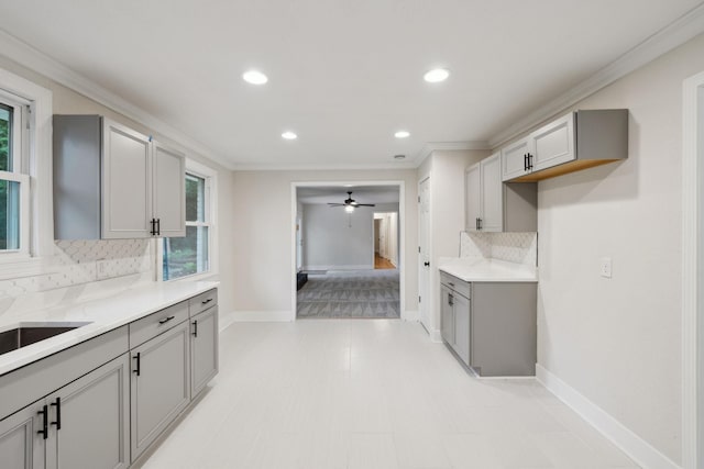 909 Plateau Pkwy, Nashville, TN 37205 - kitchen with gray cabinets, tasteful backsplash, crown molding, baseboards, and recessed lighting