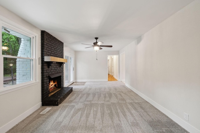 909 Plateau Pkwy, Nashville, TN 37205 - unfurnished living room with carpet, a fireplace, a ceiling fan, and baseboards