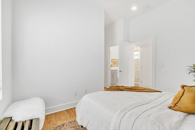 1056E 2nd Ave S, Nashville, TN 37210 - bedroom featuring light wood-style floors, baseboards, ensuite bathroom, and recessed lighting