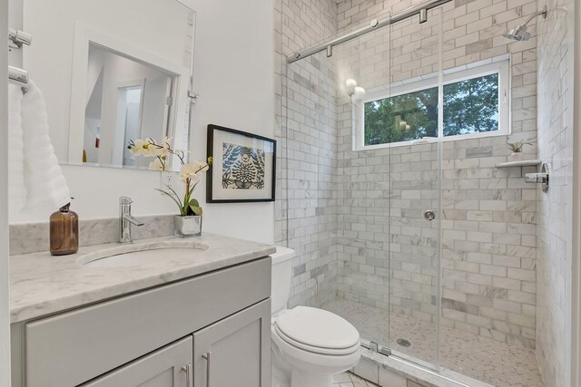1056E 2nd Ave S, Nashville, TN 37210 - full bathroom with a shower stall, toilet, and vanity