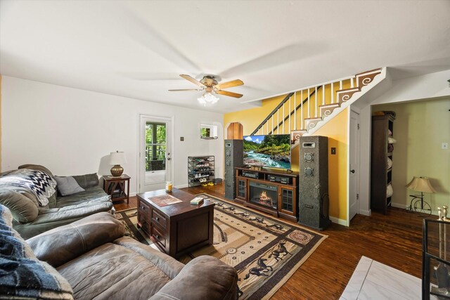 747 Hunting Creek Rd, Whitleyville, TN 38588 - living room with stairs, wood finished floors, ceiling fan, and baseboards