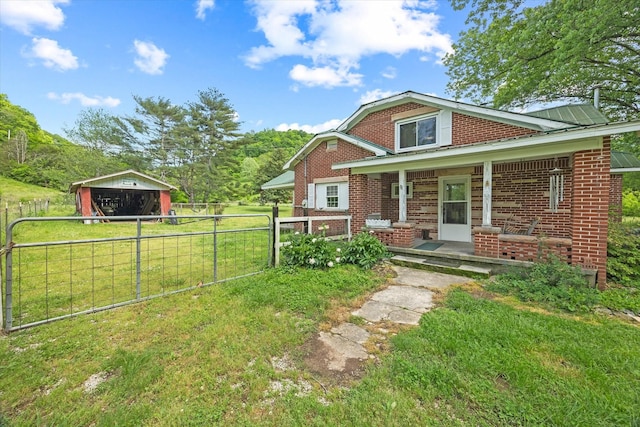 747 Hunting Creek Rd, Whitleyville, TN 38588 - view of front of home with brick siding and a porch