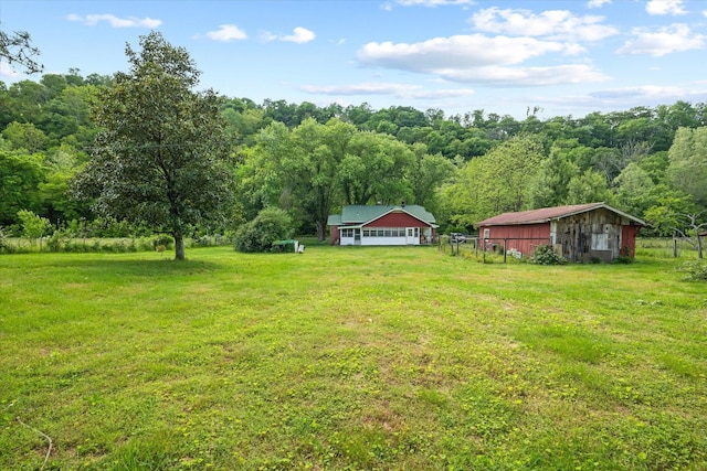 747 Hunting Creek Rd, Whitleyville, TN 38588 - view of grassy yard with a view of trees, an outbuilding, and an outdoor structure