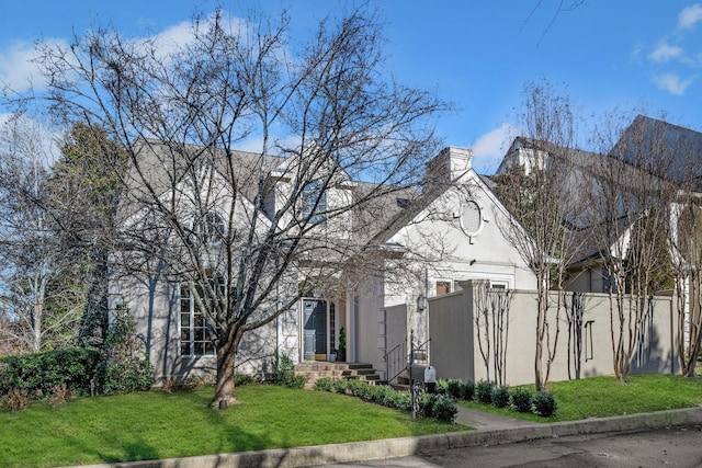 133 Brighton Close, Nashville, TN 37205 - view of front of property featuring stucco siding, a chimney, and a front yard