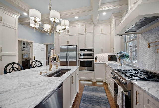 133 Brighton Close, Nashville, TN 37205 - kitchen with a sink, premium appliances, under cabinet range hood, a chandelier, and coffered ceiling