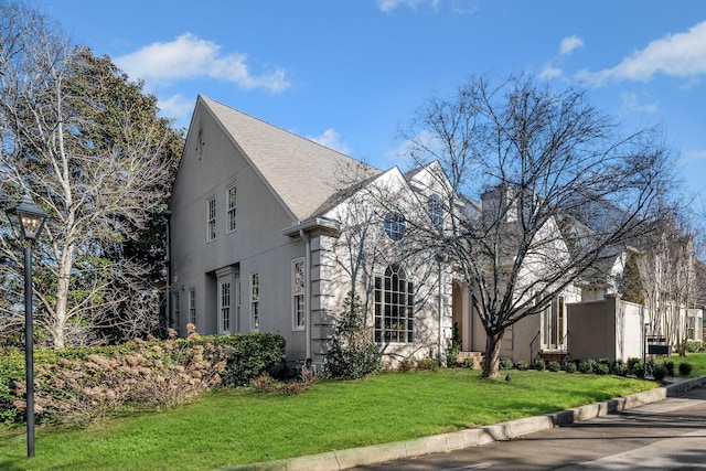 133 Brighton Close, Nashville, TN 37205 - view of side of property featuring stucco siding, a yard, and a shingled roof