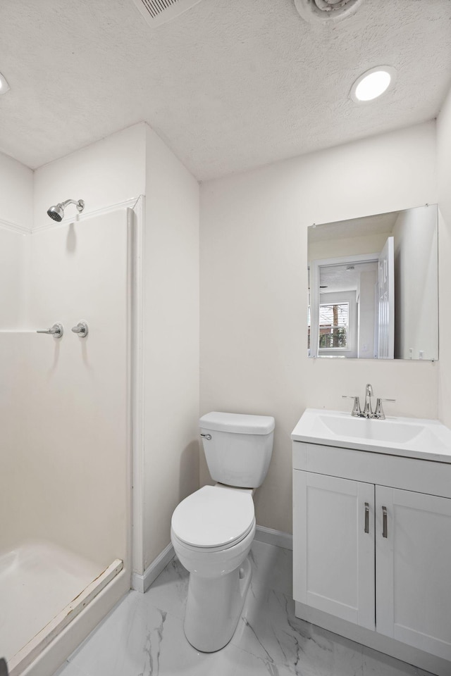full bathroom featuring a stall shower, marble finish flooring, toilet, and a textured ceiling