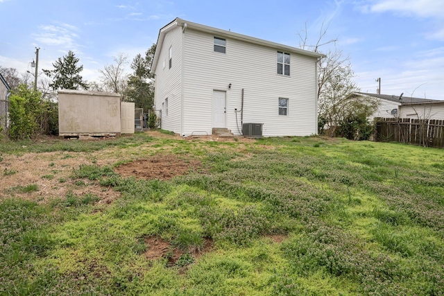 rear view of house with central AC