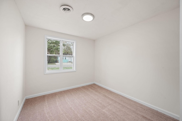spare room with carpet flooring and baseboards