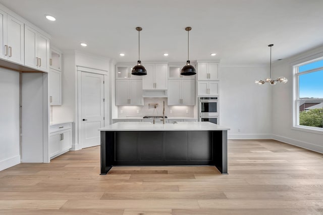 1018 Keeneland Dr, Gallatin, TN 37066 - kitchen featuring stainless steel double oven, light countertops, white cabinetry, light wood-style floors, and crown molding