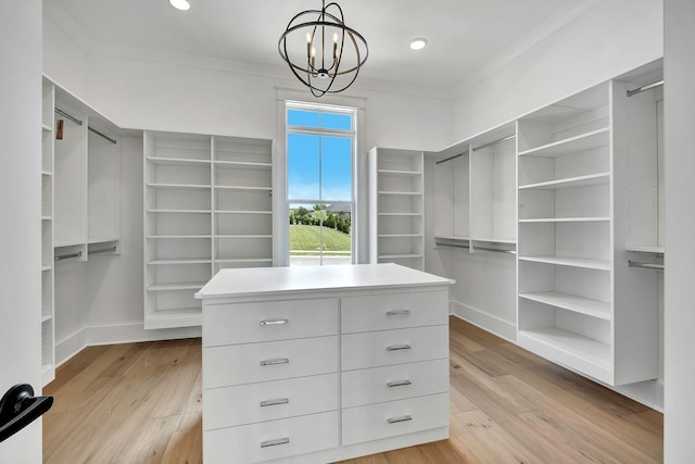 1018 Keeneland Dr, Gallatin, TN 37066 - walk in closet with a chandelier and light wood finished floors