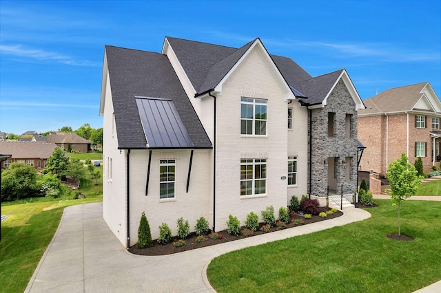 1018 Keeneland Dr, Gallatin, TN 37066 - view of front of house with brick siding, a front yard, a residential view, and a shingled roof