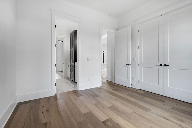 1018 Keeneland Dr, Gallatin, TN 37066 - unfurnished bedroom featuring light wood-style flooring, a closet, and baseboards