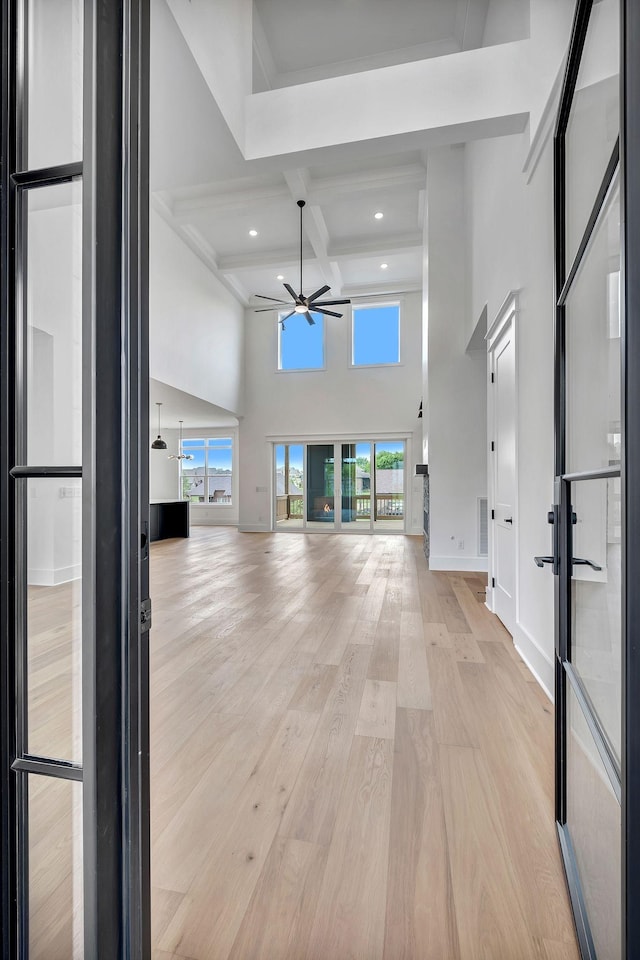 1018 Keeneland Dr, Gallatin, TN 37066 - entryway featuring ceiling fan, a towering ceiling, beamed ceiling, plenty of natural light, and light wood finished floors