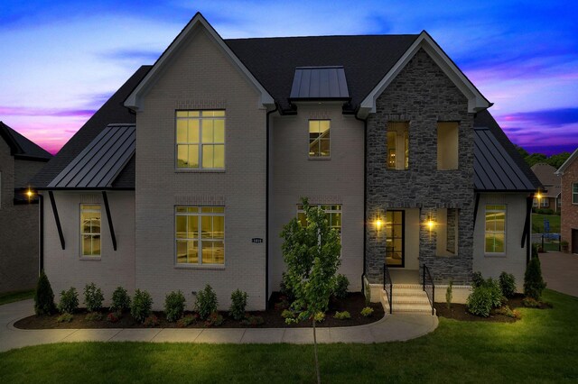 1018 Keeneland Dr, Gallatin, TN 37066 - view of front of home with a standing seam roof, metal roof, stone siding, and a yard
